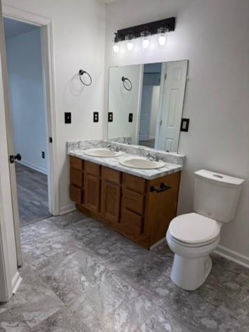 39 North Ridge Drive Northwest Adairsville, GA 30103 - Photo 21 of 25 a bathroom with a granite countertop toilet a sink and a mirror