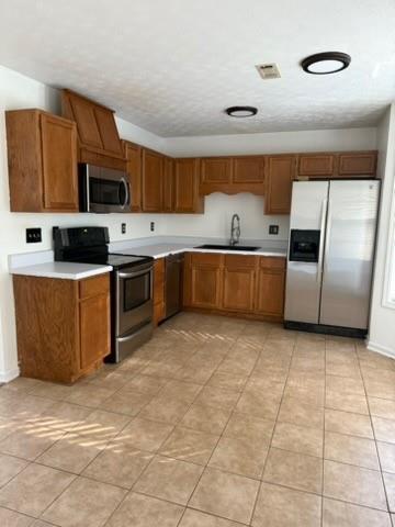 39 North Ridge Drive Northwest Adairsville, GA 30103 - Photo 7 of 25 a kitchen with stainless steel appliances granite countertop a stove top oven a sink a counter top space and cabinets