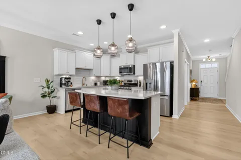 a kitchen with a sink and a counter top space