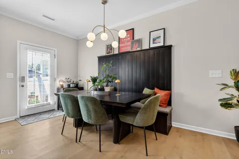 a view of dining room and kitchen with a chandelier