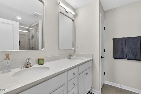 a bedroom with a large bed and a book shelf