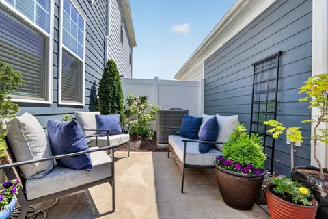 a outdoor living space with furniture and a potted plant