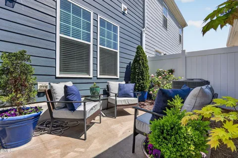 a view of a backyard with sitting area