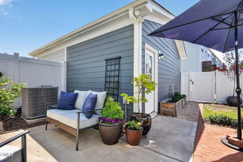 a view of a patio with couches and potted plants