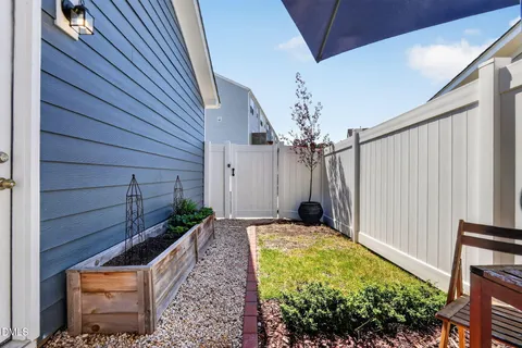 a view of a backyard with potted plants