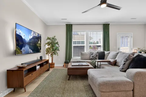 a view of a hallway with workspace and wooden floor