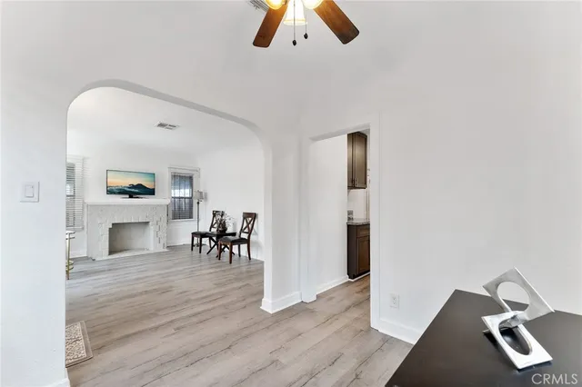 an entryway and livingroom with furniture