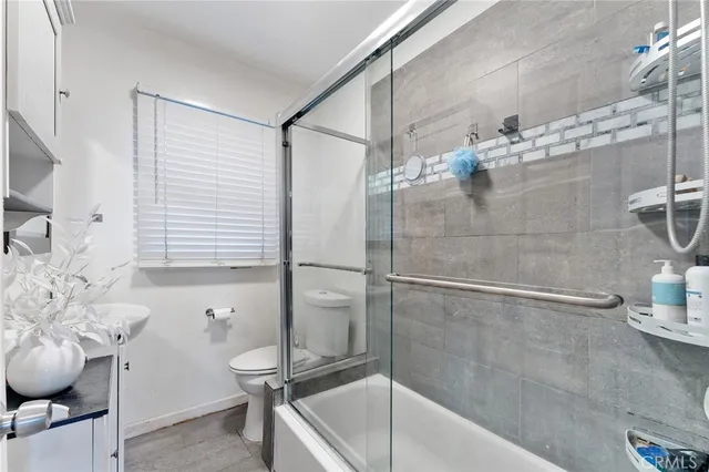 a bathroom with a bathtub and shower