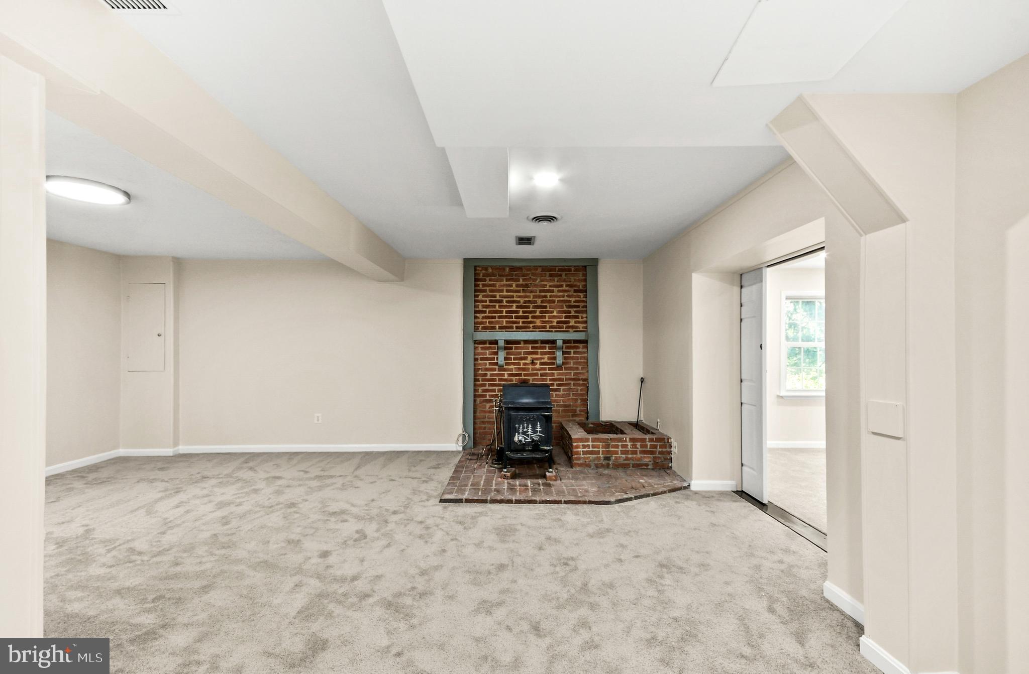 2528 Monocacy Bottom Road Adamstown, MD 21710 - Photo 14 of 61 The lower level family room has a wood stove