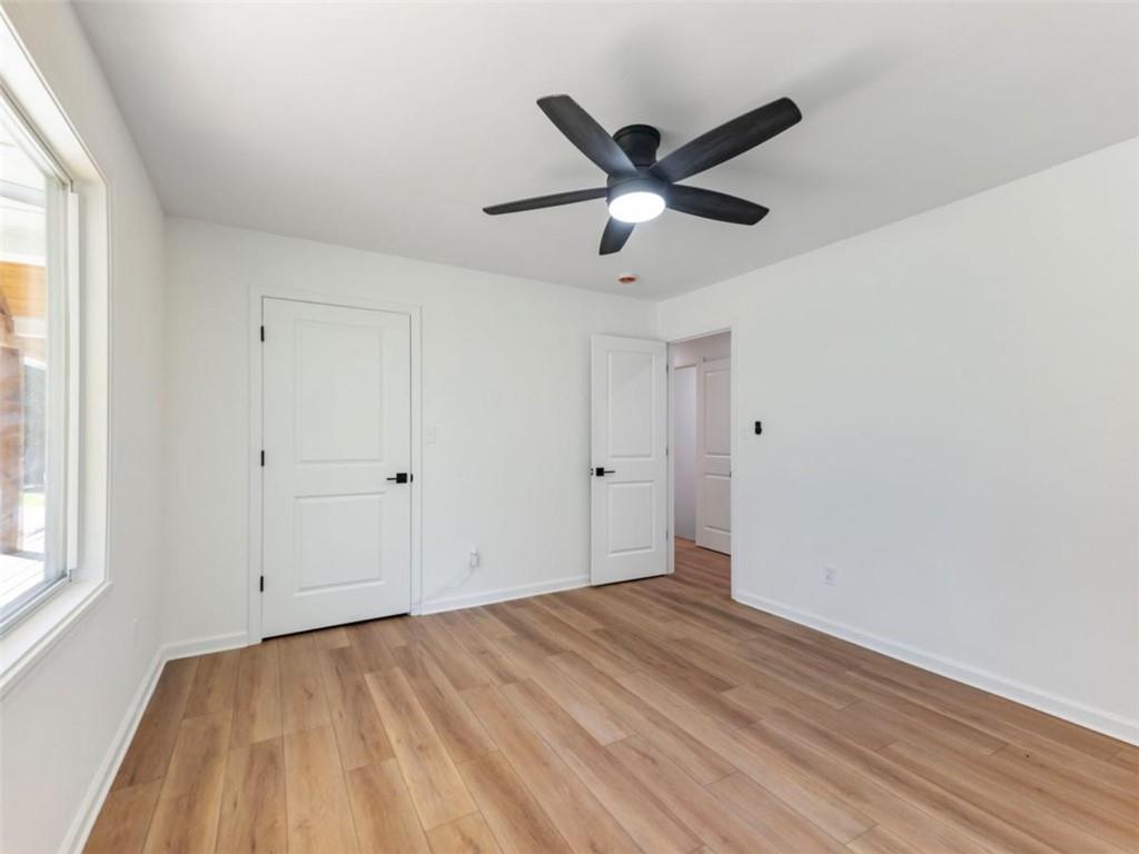 1328 Jefferson Highway Winder, GA 30680 - Photo 34 of 64 a view of a big room with wooden floor and windows in a room