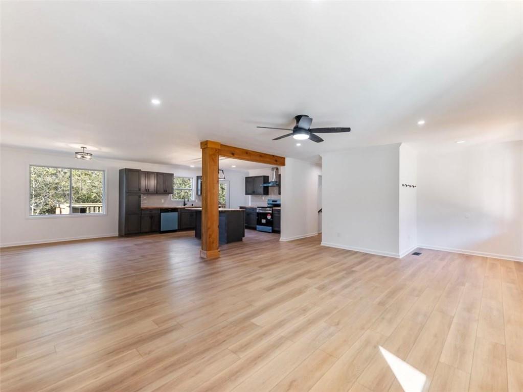 1328 Jefferson Highway Winder, GA 30680 - Photo 4 of 64 a view of a kitchen with a sink and a refrigerator