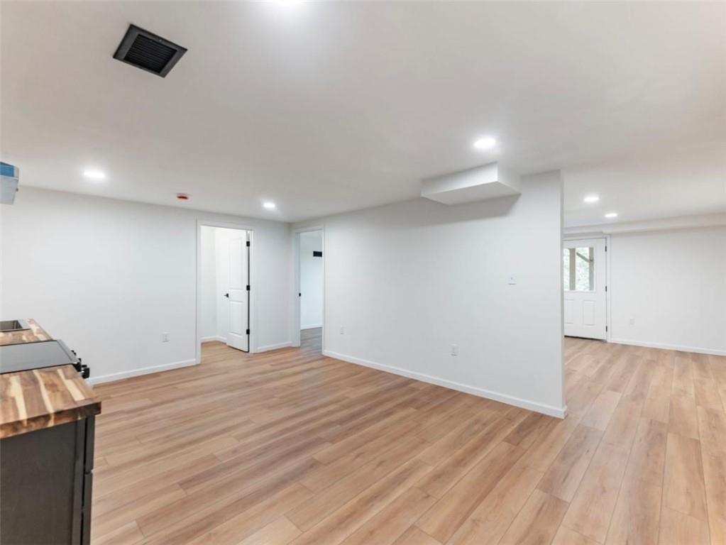 1328 Jefferson Highway Winder, GA 30680 - Photo 43 of 64 a view of an empty room with wooden floor