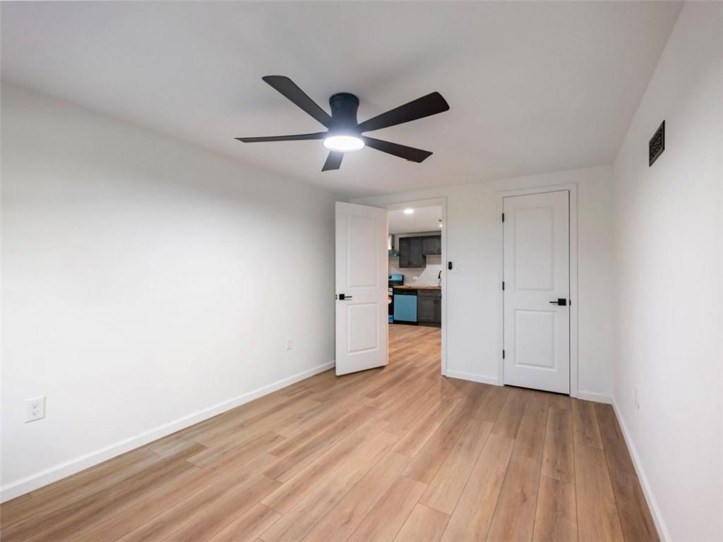 1328 Jefferson Highway Winder, GA 30680 - Photo 45 of 64 a view of empty room with wooden floor and ceiling fan