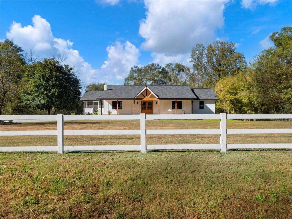 1328 Jefferson Highway Winder, GA 30680 - Photo 47 of 64 a view of a house with a swimming pool