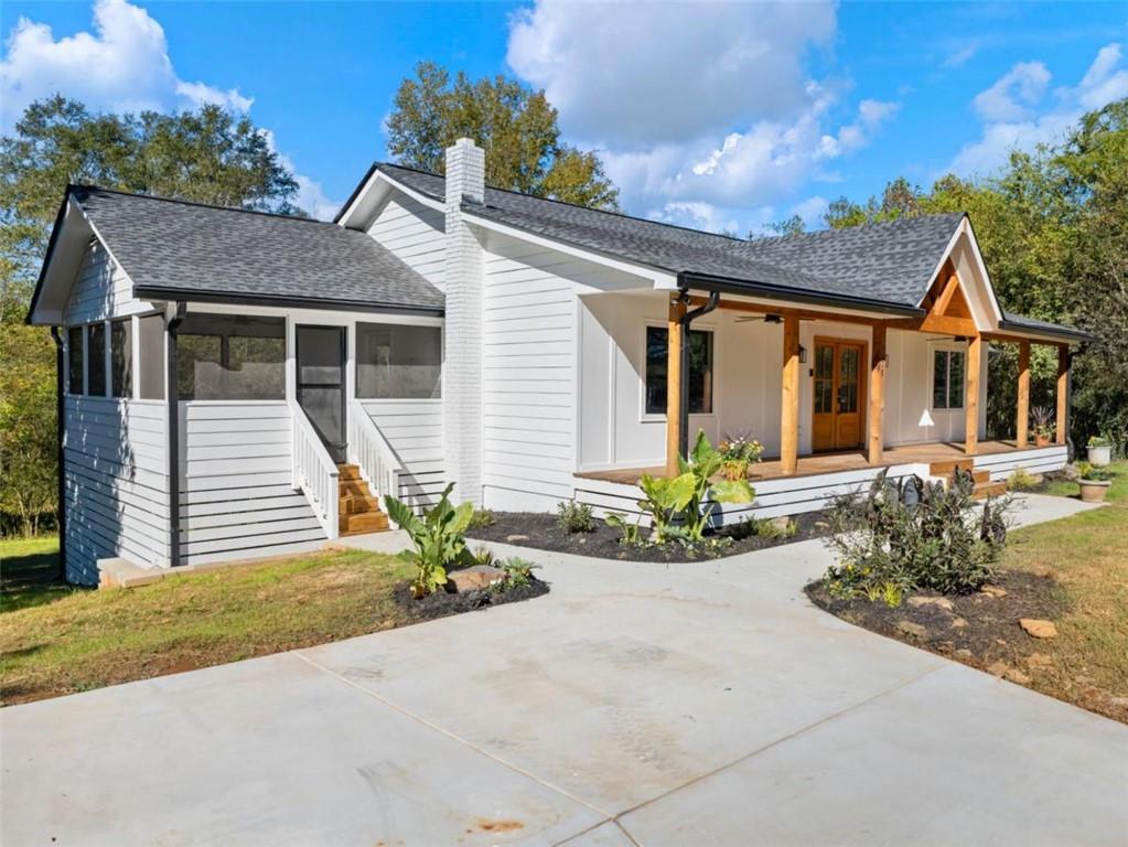 1328 Jefferson Highway Winder, GA 30680 - Photo 51 of 64 front view of a house with a bench
