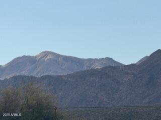 217 Fairhaven Road Kearny, AZ 85137 - Photo 11 of 13 a view of a dry field with mountains in the background