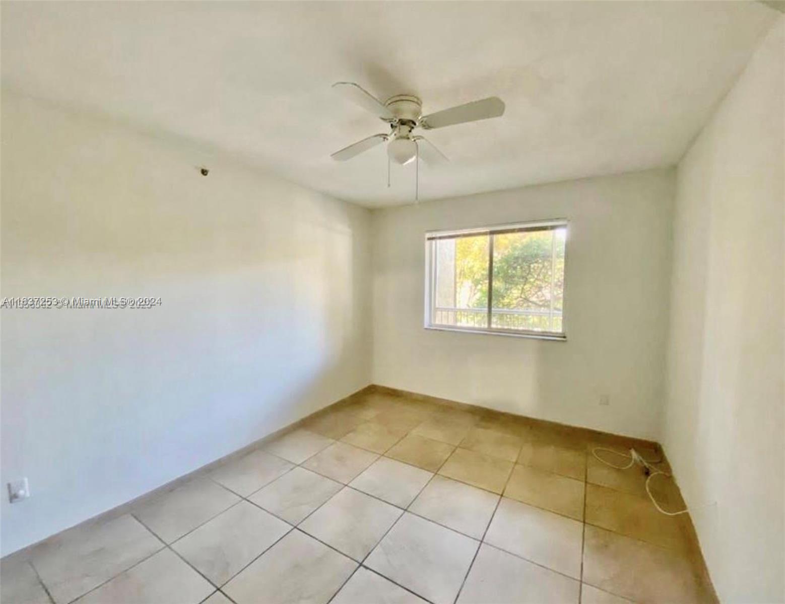 430 South Park Road, Unit 3204 Hollywood, FL 33021 - Photo 4 of 9 a view of an empty room with a window