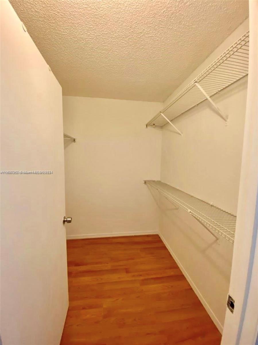 430 South Park Road, Unit 3204 Hollywood, FL 33021 - Photo 5 of 9 a view of walk in closet with empty racks