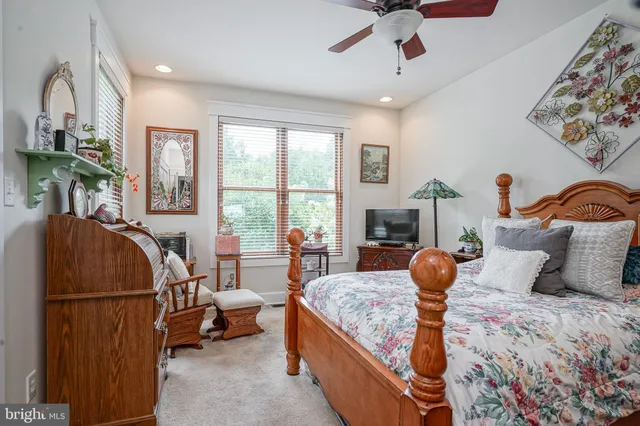 a living room with furniture a couch and a window