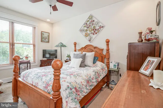 a bedroom with bed and window