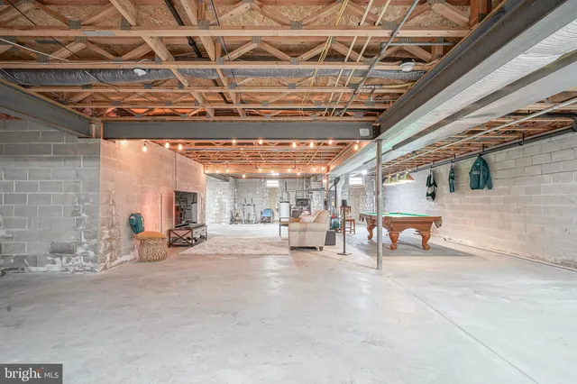 a view of a room with wooden ceiling