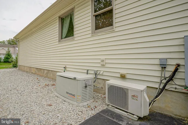 a view of a patio with table and chairs