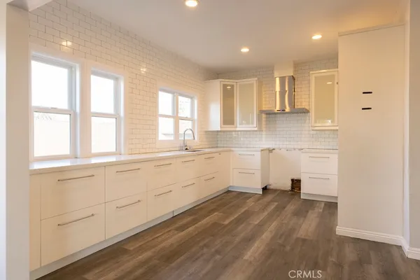 a view of a kitchen with electric appliances