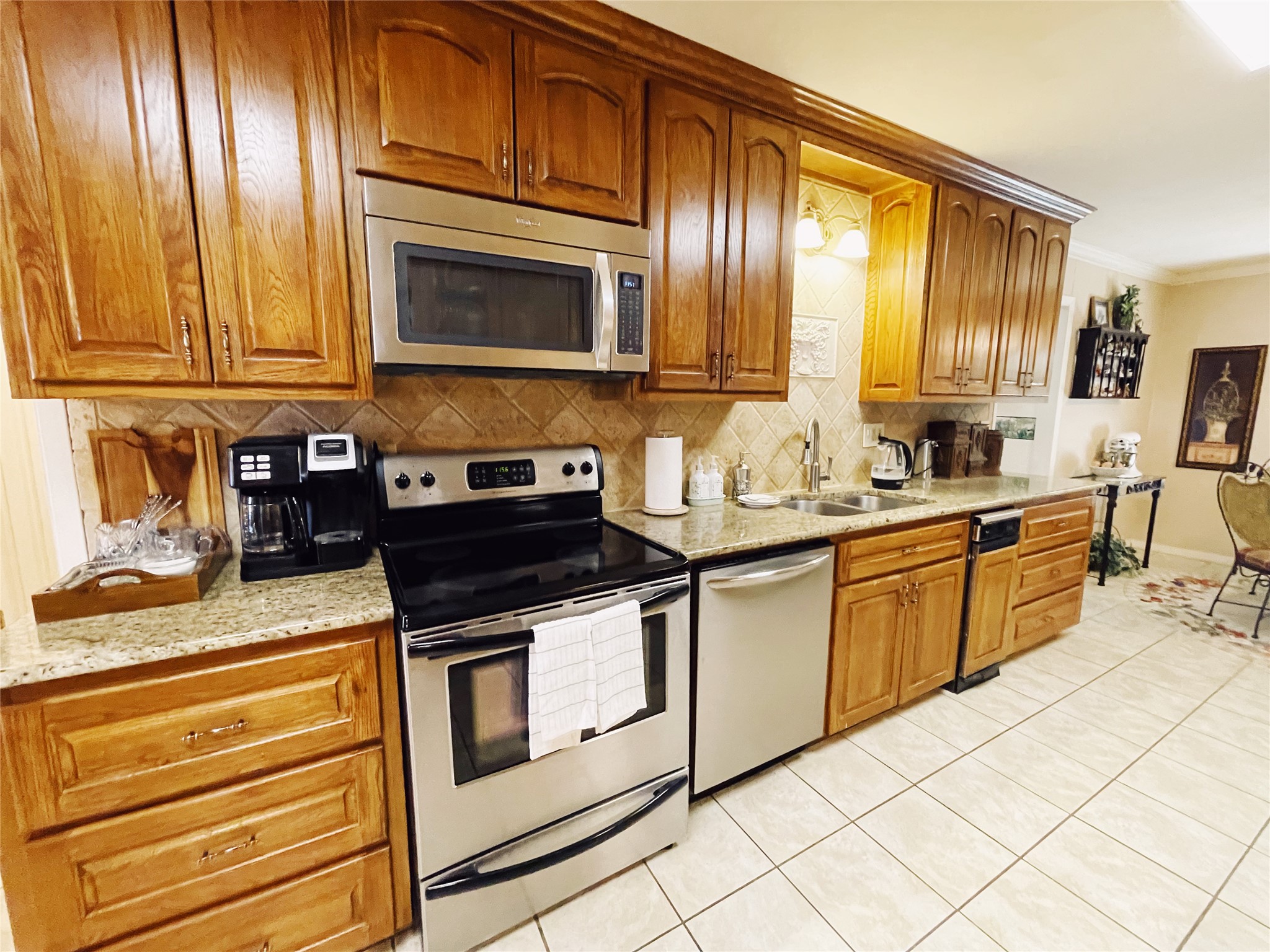 700 Shanklin Road Belton, TX 76513 - Photo 13 of 33 a kitchen with granite countertop cabinets stainless steel appliances and a counter space