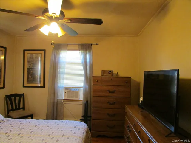 a bedroom with a bed and furniture