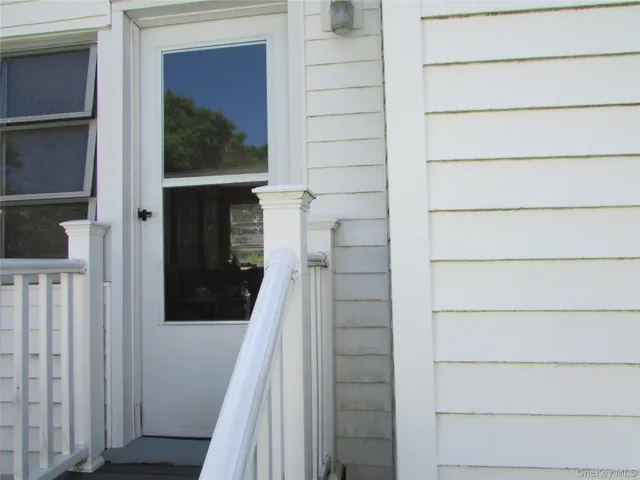 a view of entryway with a wooden floor