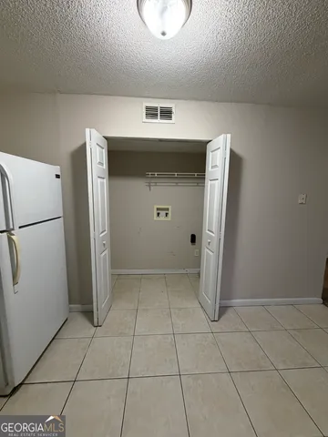 a view of a kitchen with a sink and cabinets
