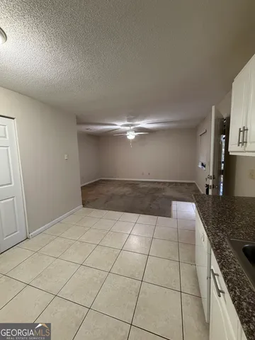 a bathroom with a sink mirror vanity and toilet