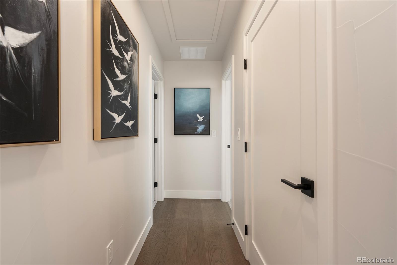 34 Wheeler Road Winter Park, CO 80482 - Photo 20 of 50 a view of a hallway with wooden floor and a bathroom