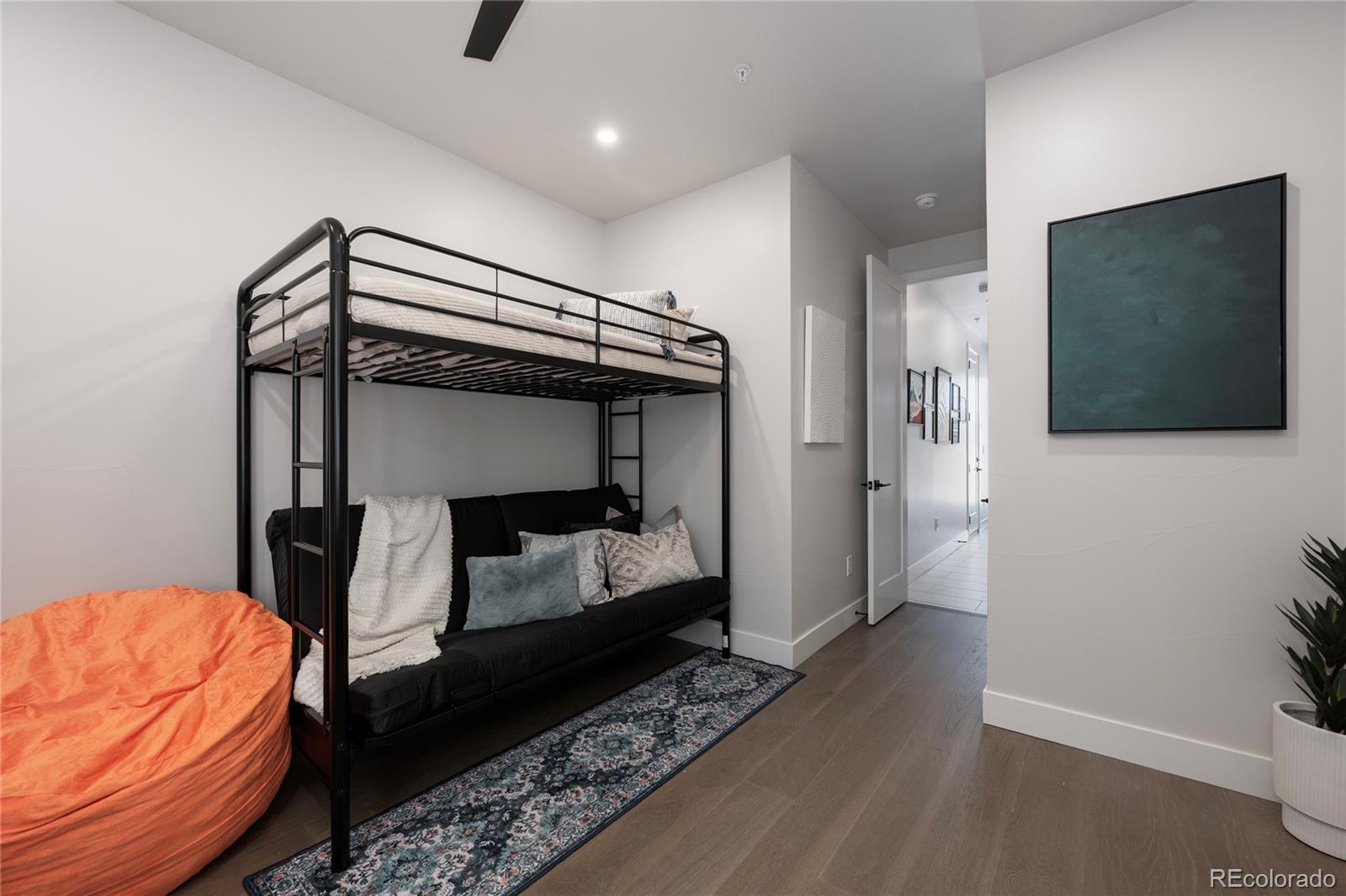 34 Wheeler Road Winter Park, CO 80482 - Photo 35 of 50 a bedroom with a bed and a flat tv screen on wall