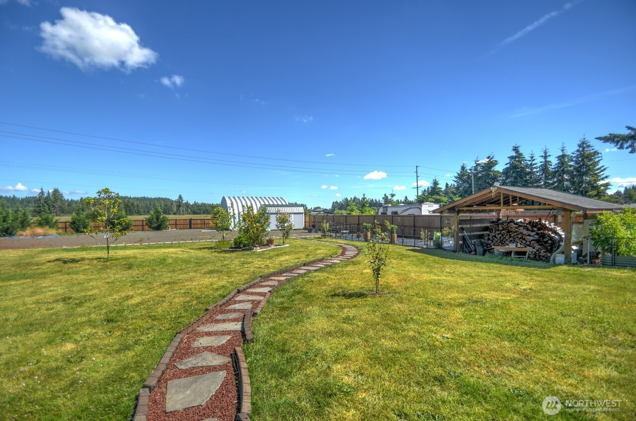 5922 184th Lane Southwest Rochester, WA 98579 - Photo 23 of 34 a view of a swimming pool and a yard