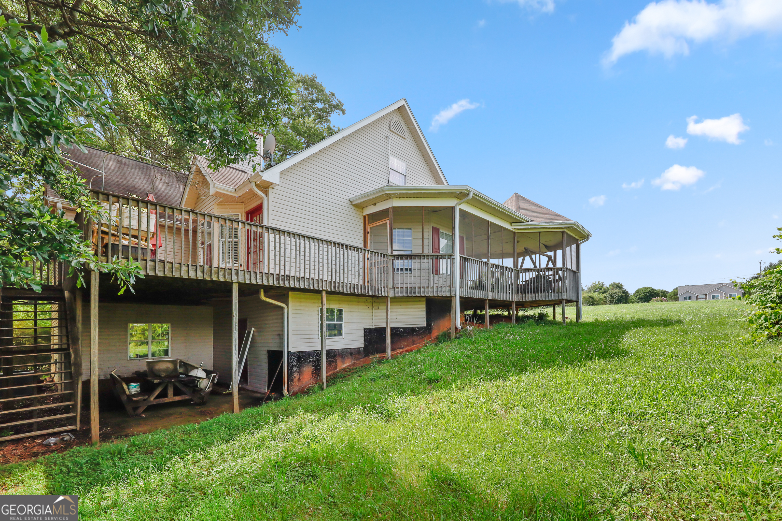 2433 Bear Creek Road Statham, GA 30666 - Photo 56 of 58 a view of a house with a yard and sitting area