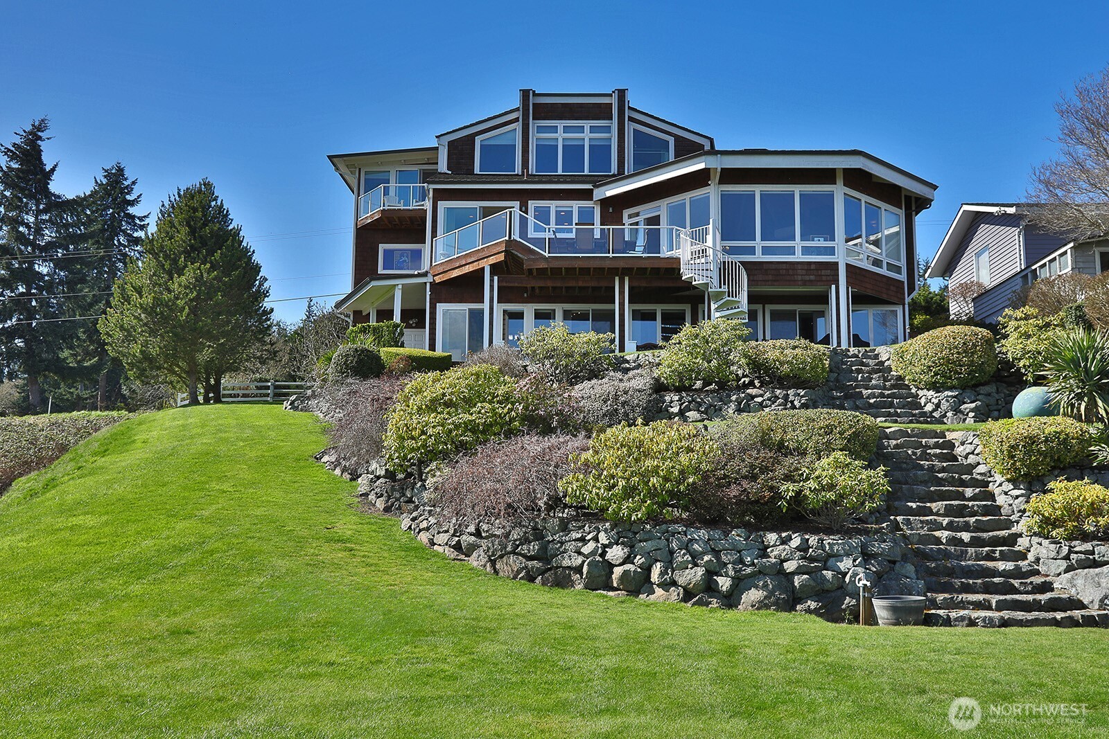 6595 Anderson Road Clinton, WA 98236 - Photo 11 of 40 a front view of a house with a garden