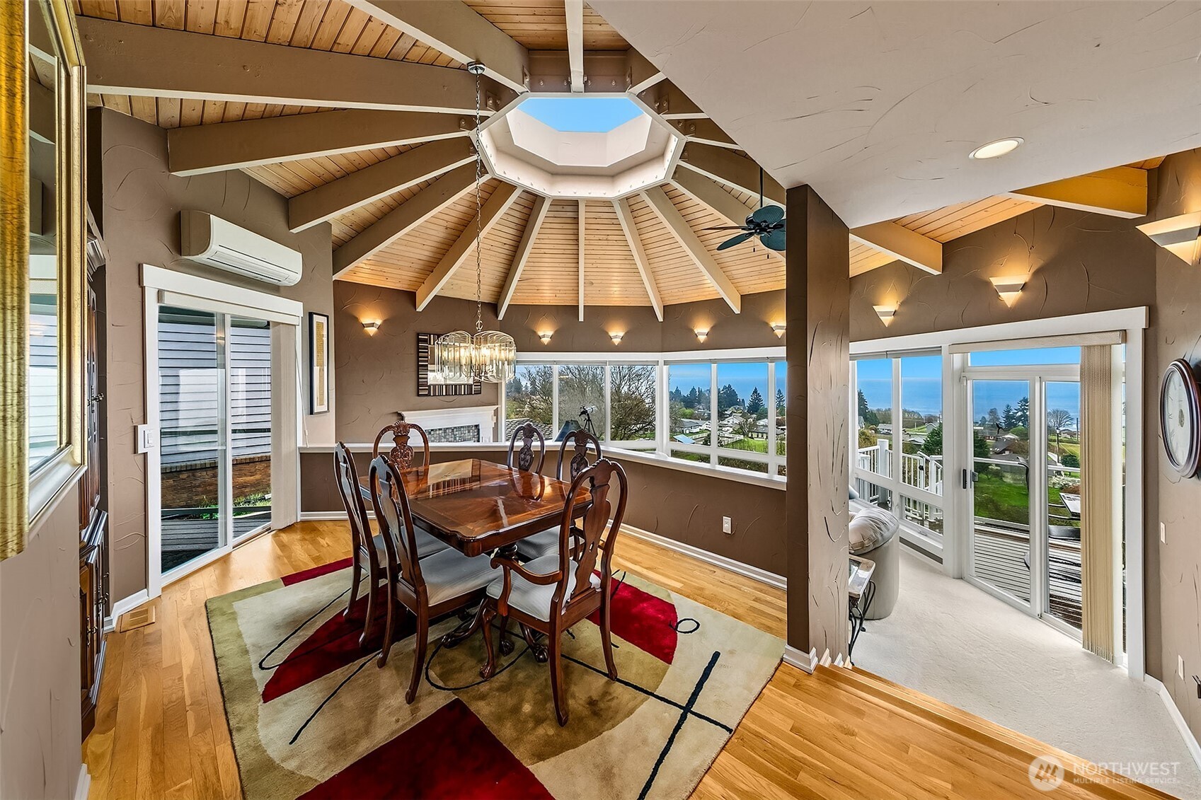 6595 Anderson Road Clinton, WA 98236 - Photo 14 of 40 a dining room with furniture and wooden floor