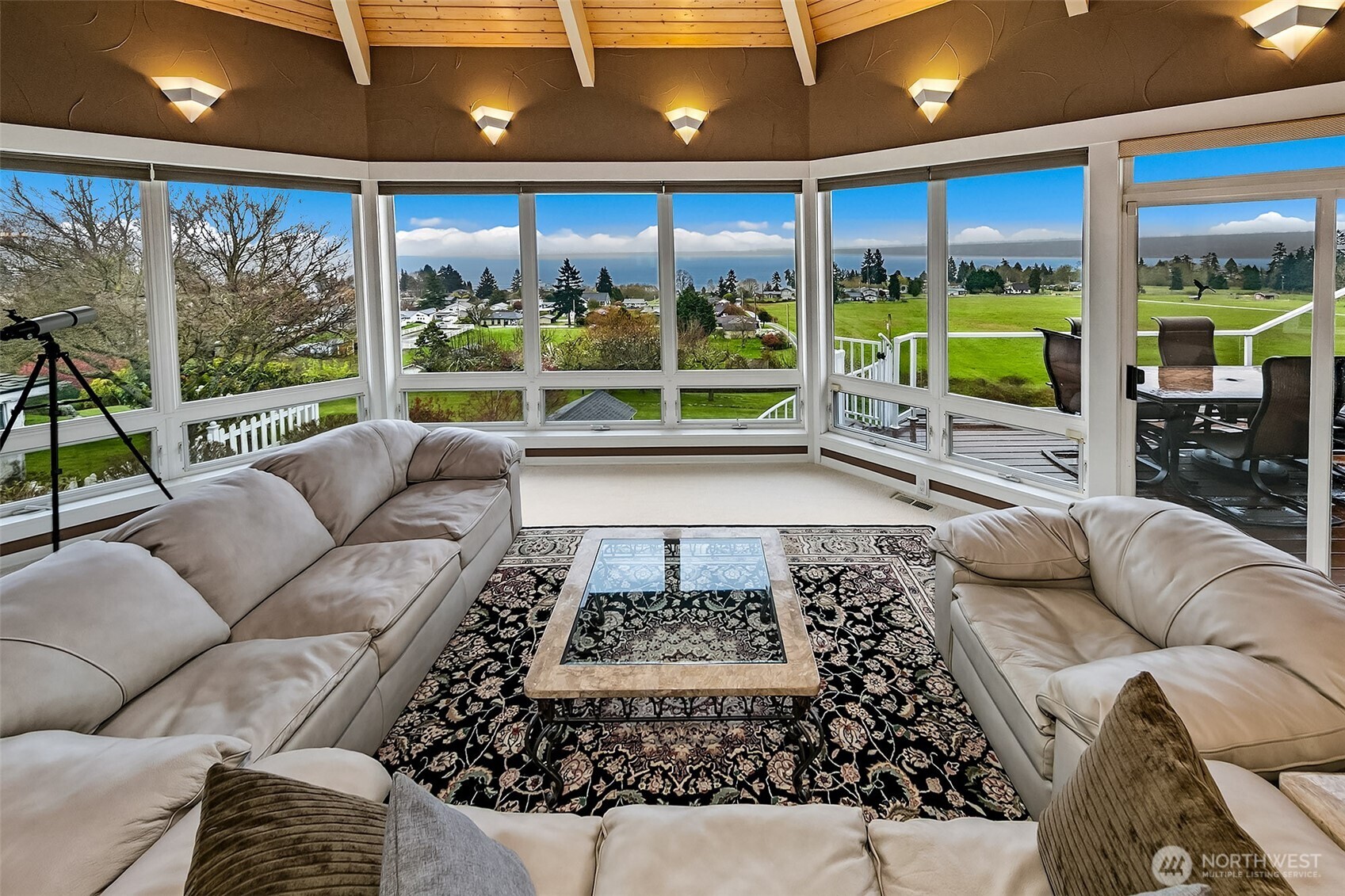 6595 Anderson Road Clinton, WA 98236 - Photo 16 of 40 a living room with furniture granite table and a large window