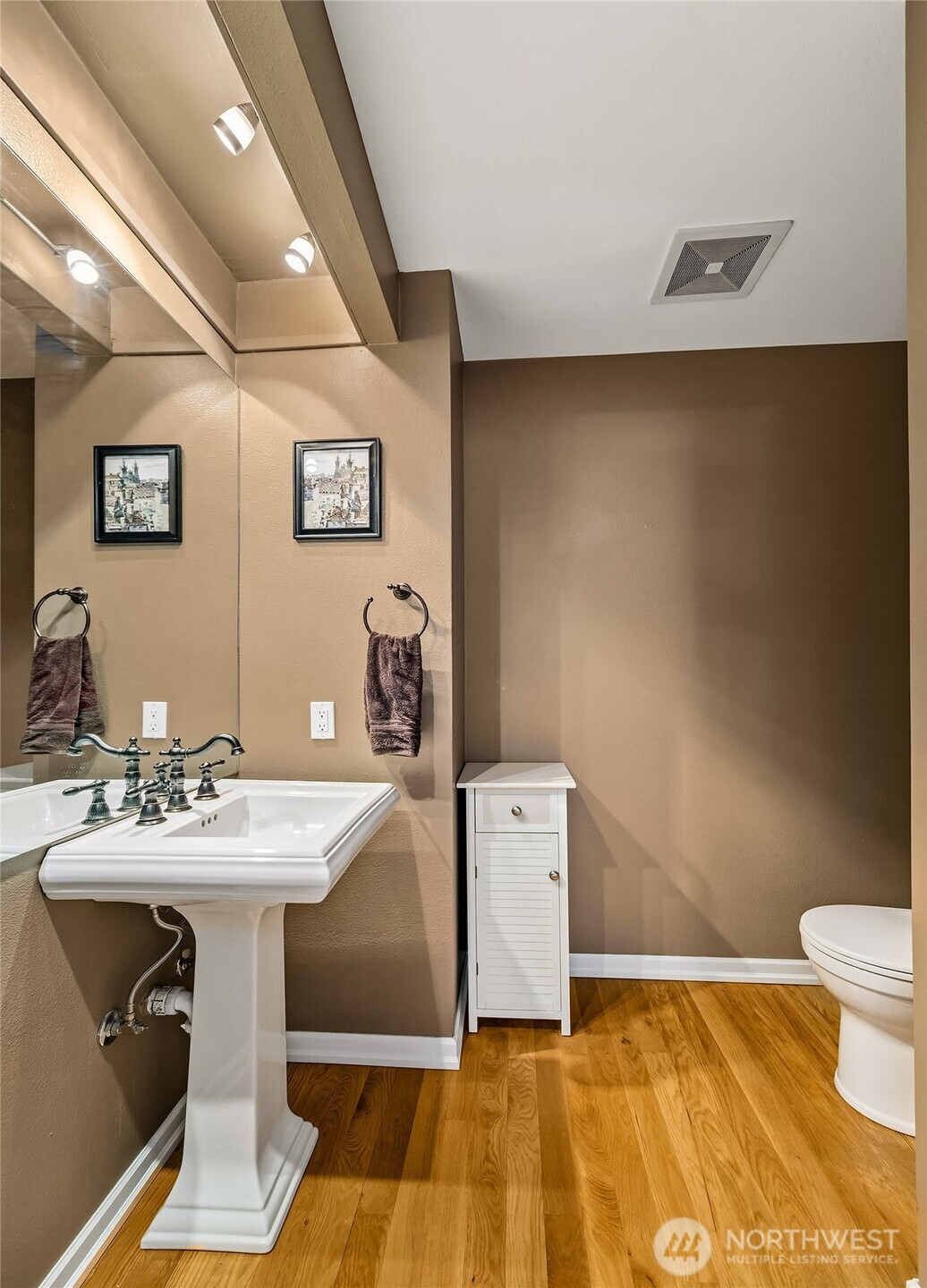 6595 Anderson Road Clinton, WA 98236 - Photo 19 of 40 a bathroom with a sink mirror and toilet
