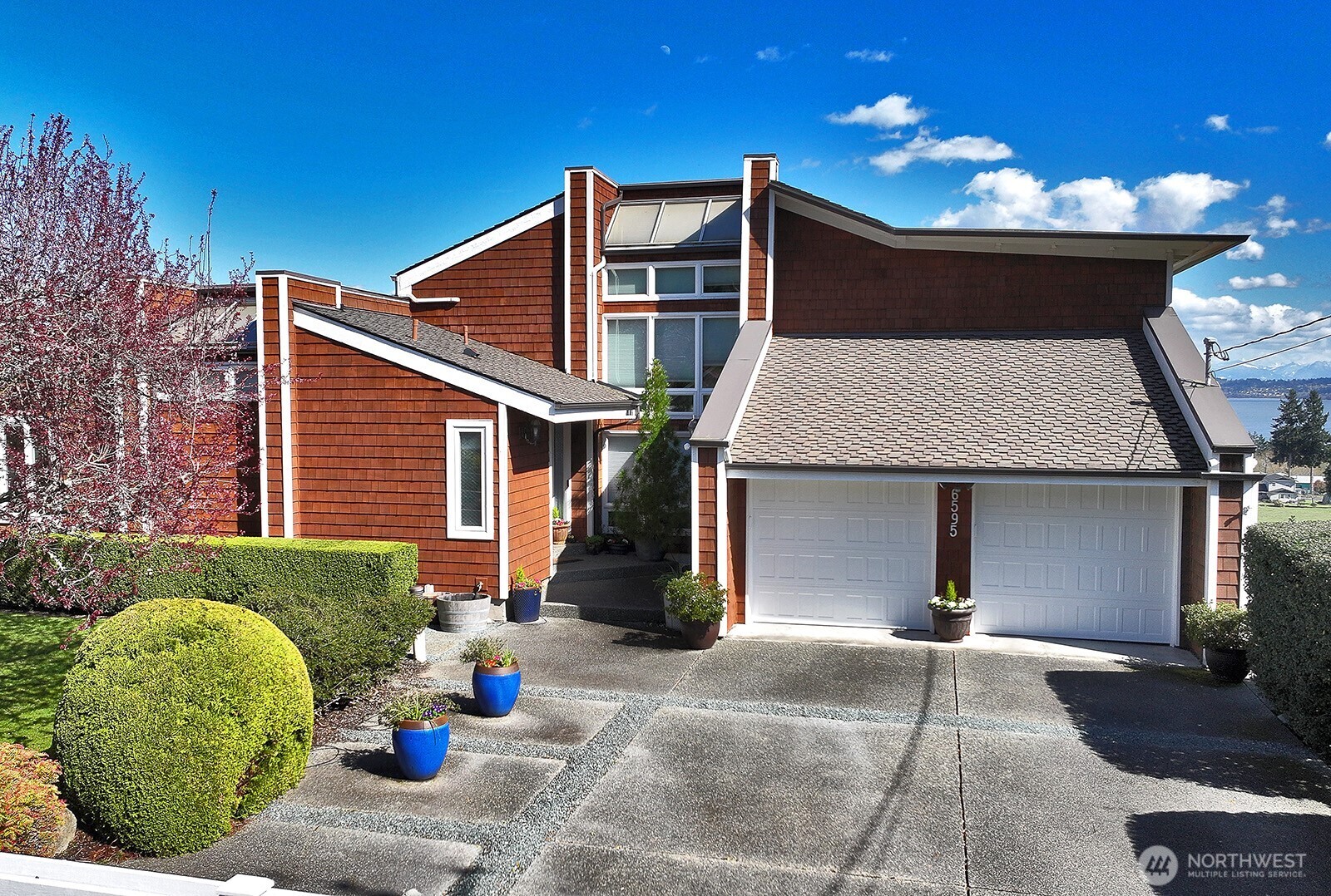 6595 Anderson Road Clinton, WA 98236 - Photo 2 of 40 a view of a house with a patio