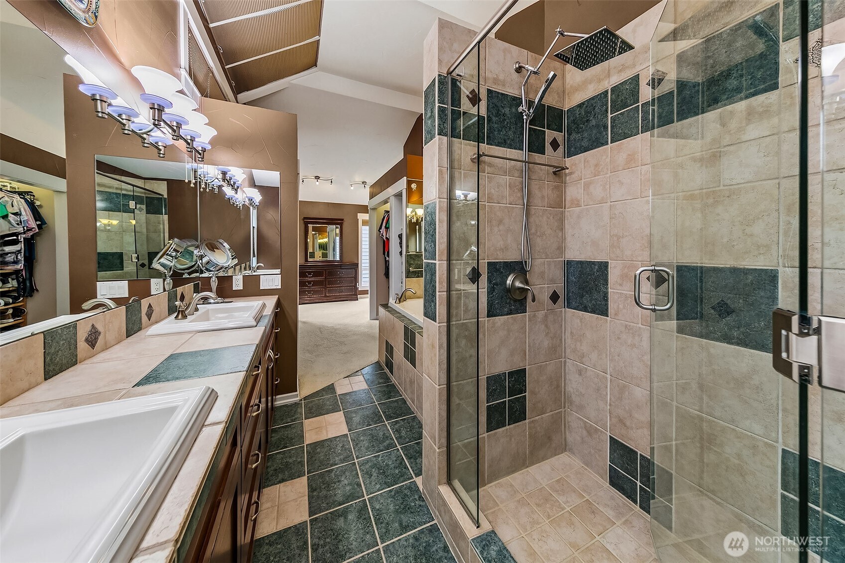 6595 Anderson Road Clinton, WA 98236 - Photo 26 of 40 a bathroom with a tub a mirror and shower