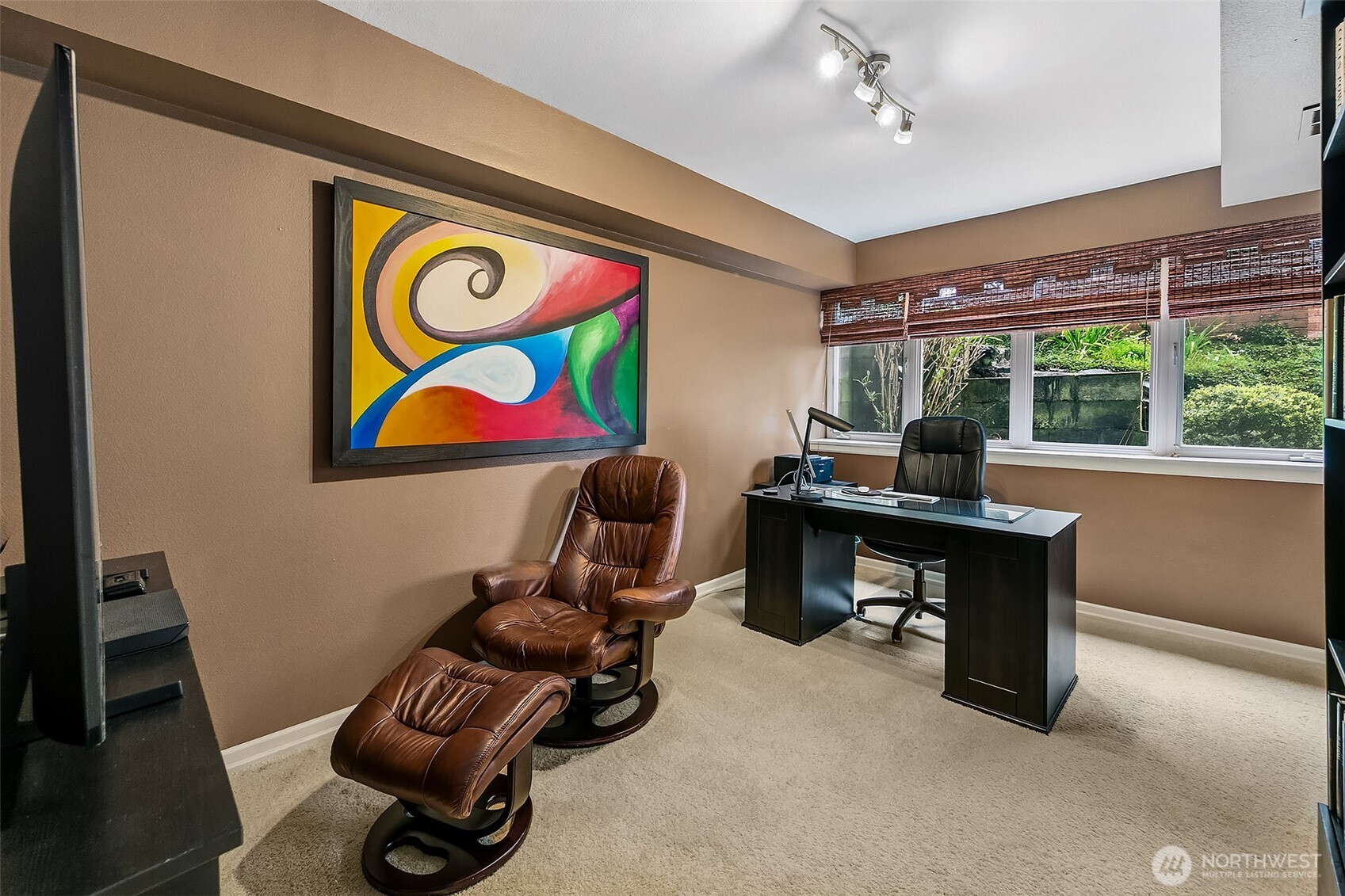 6595 Anderson Road Clinton, WA 98236 - Photo 30 of 40 a work room with furniture and a floor to ceiling window