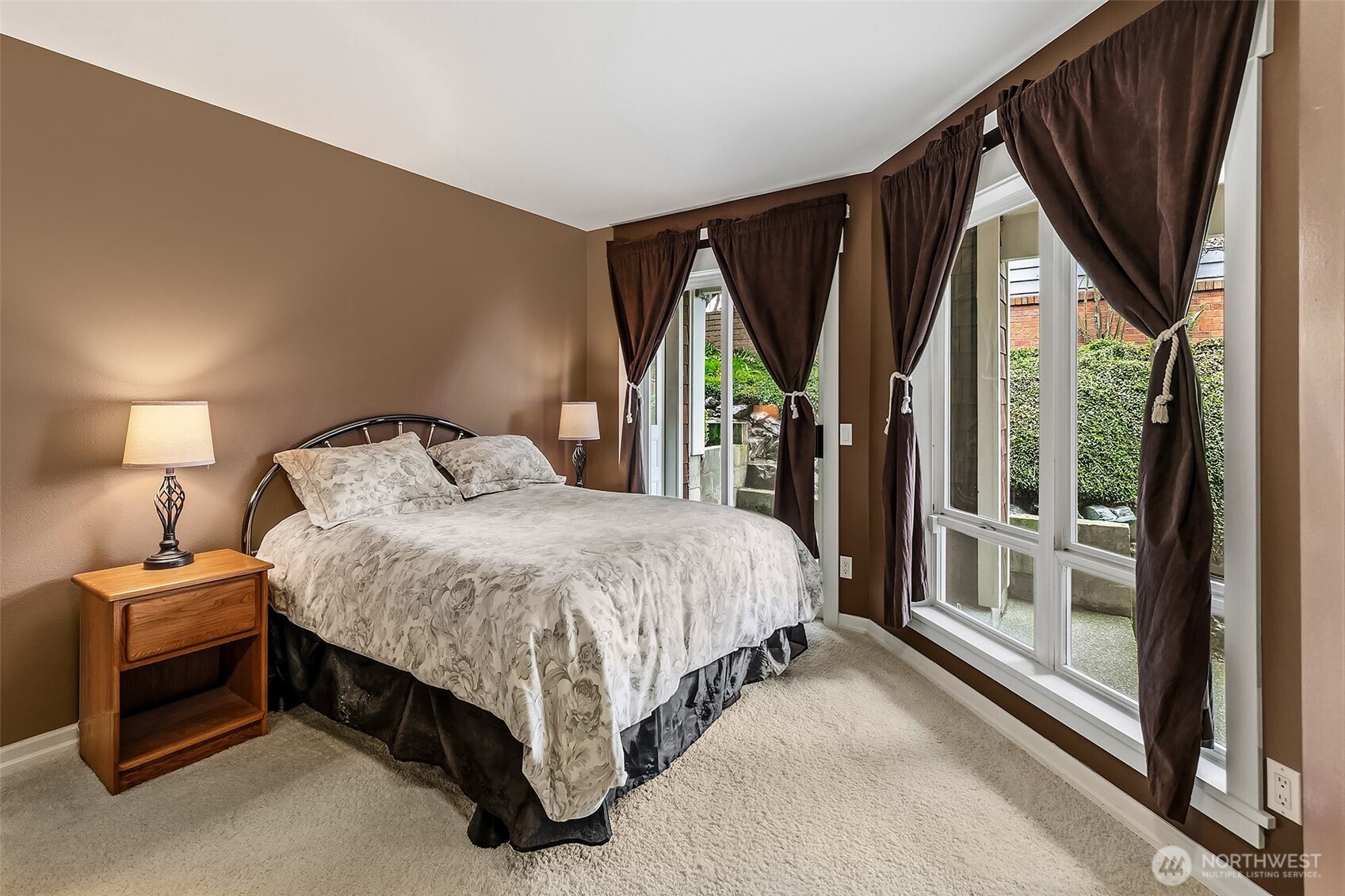6595 Anderson Road Clinton, WA 98236 - Photo 31 of 40 a spacious bedroom with a bed and a large window