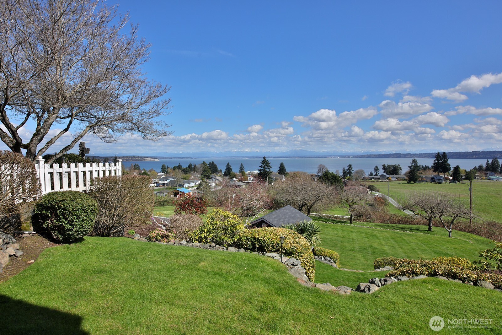 6595 Anderson Road Clinton, WA 98236 - Photo 10 of 40 a view of a garden with an houses