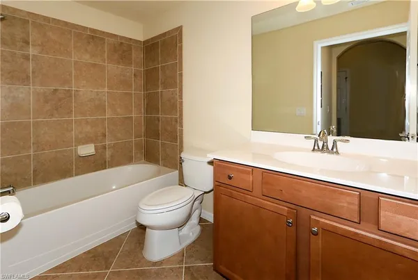 a bathroom with a sink a toilet and bathtub