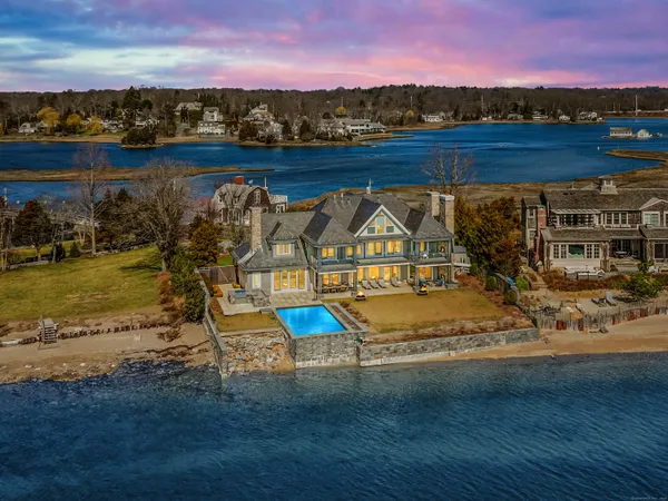 an aerial view of a house with a lake view