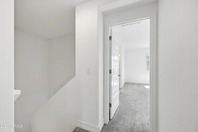 a view of a room with a hallway