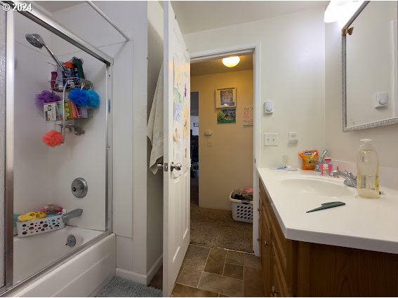 4847-4849 Elderberry Loop Springfield, OR 97478 - Photo 11 of 23 a bathroom with a sink a tub and a shower