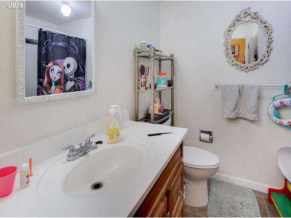 4847-4849 Elderberry Loop Springfield, OR 97478 - Photo 13 of 23 a bathroom with a sink mirror and toilet